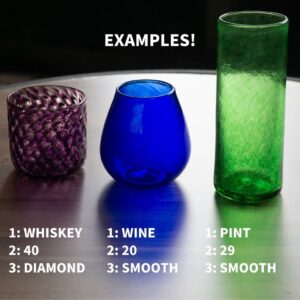 Three glasses of different colors and shapes